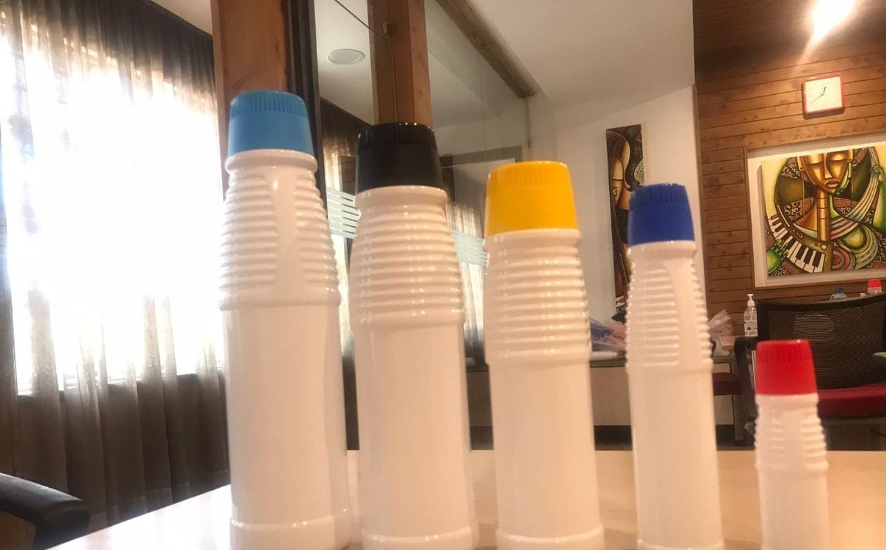 Stacked bleach bottles in 1 litre, 500ml and 250ml sizes, sold in Nairobi